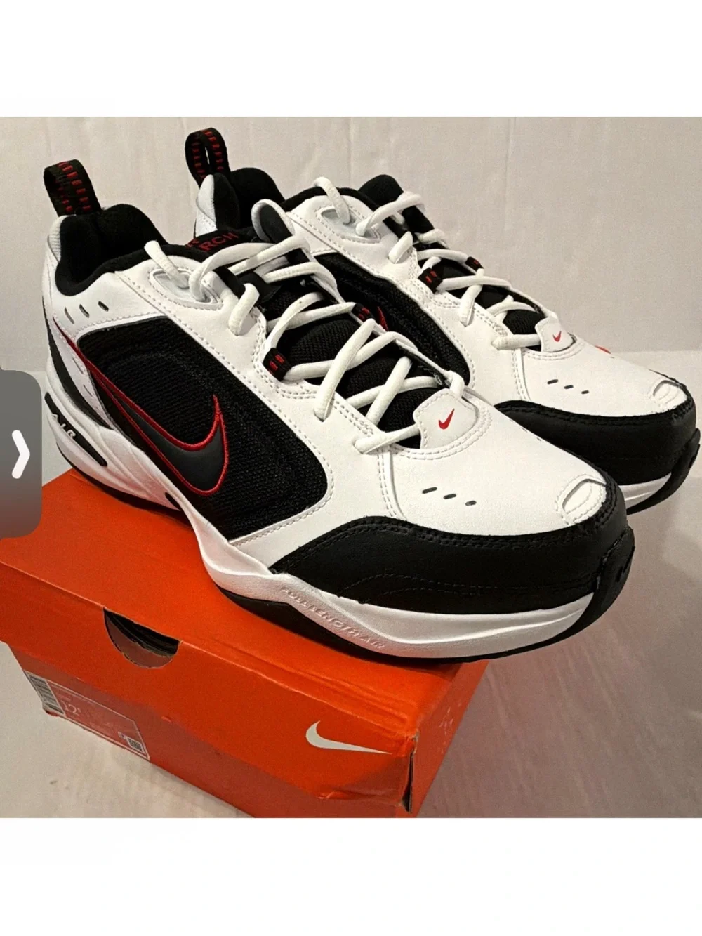 Nike Air Monarch IVMen’s White & Black Athletic Sneakers with Red Accents